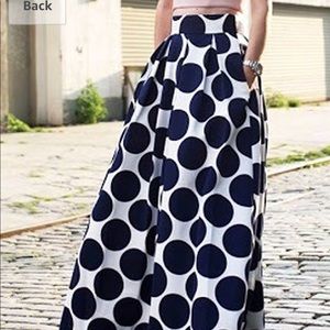 Full length high waisted pleated skirt.